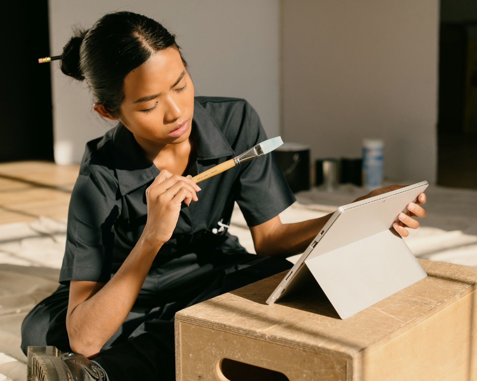 Artisan reviewing feedback on a tablet