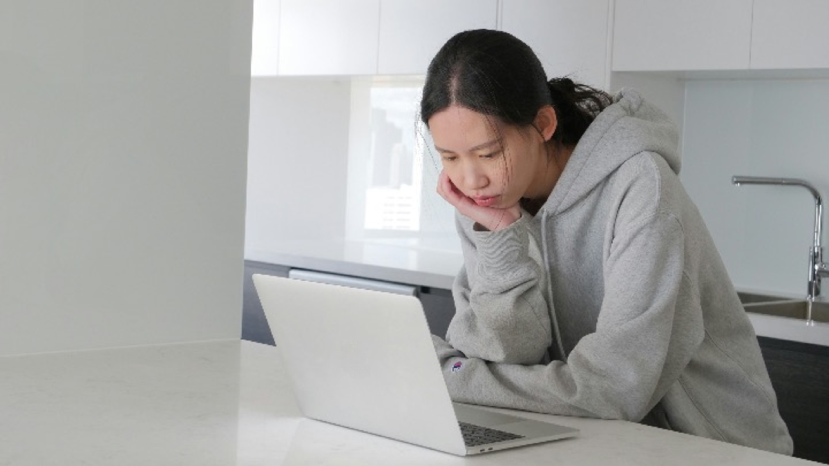 Home-based freelancer reviewing a dashboard on a laptop